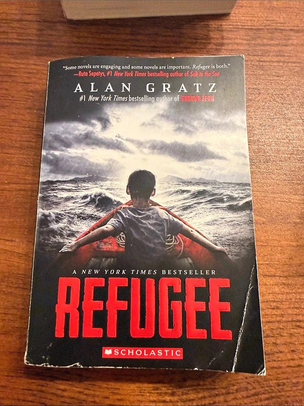 Scholastic Refugee by Alan Gratz Paperback Book, Red & Black